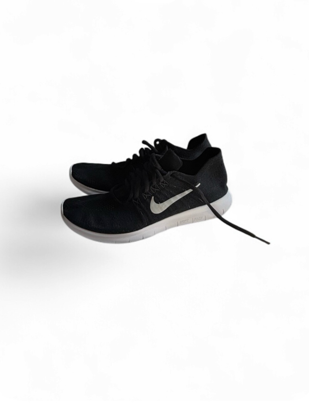 Nike Women's Black Sneakers with White Swoosh